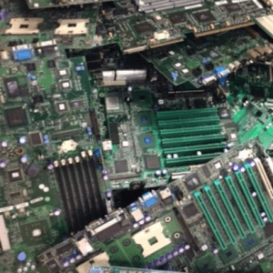 Cluster of circuit boards and electronic components, highlighting the complexity of computer hardware and its components in e-waste.
